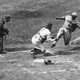 Umpire Gersel, wearing a suit and cap, watches the Chicago White Sox’s Metzler slide on the Yankees in 1932. Image via Getty.